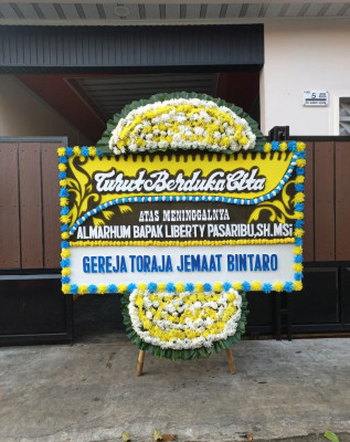 Papan Bunga Duka di Purwomartani